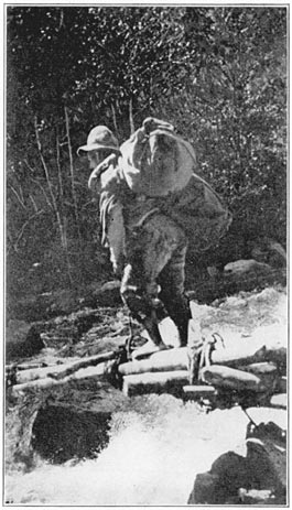 One of our Bearers Crossing the Pampaconas River