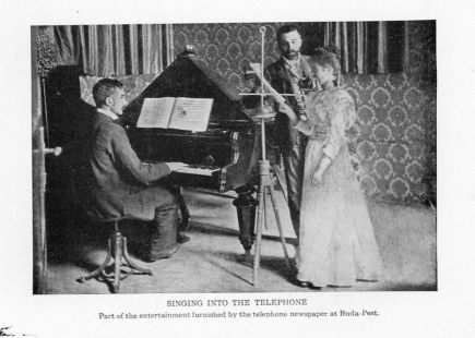 SINGING INTO THE TELEPHONE Part of the entertainment furnished by the telephone newspaper at Buda-Pest.