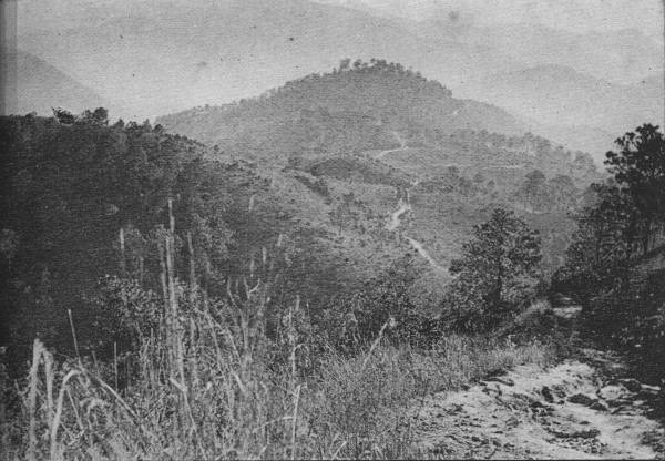 THE SWITZERLAND OF WESTERN CHINA  To travel in China is easy over country like this, granted that the traveler sticks to the main road, sample of which is seen at lower right.