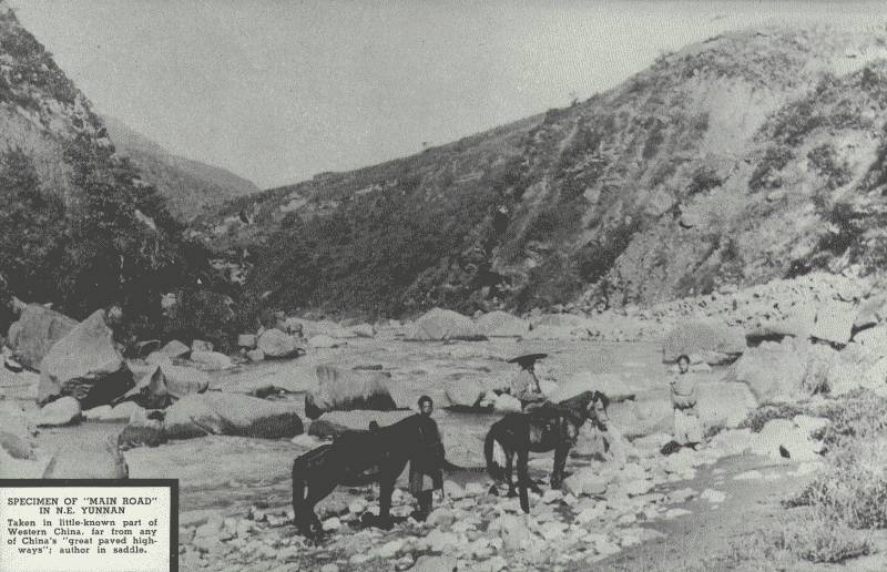 SPECIMEN OF "MAIN ROAD" IN N.E. YÜN-NAN  Taken in the little-known part of Western China, far from any of China's "great paved highways"; author is in saddle.