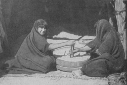 WOMEN GRINDING AT THE MILL.