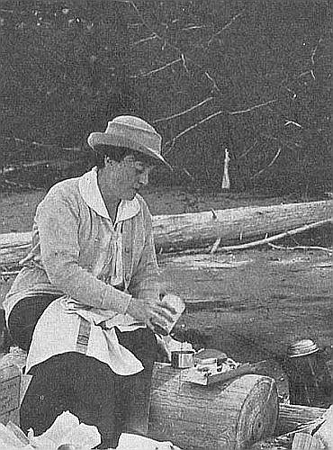 A woman outdoors in scouting attire