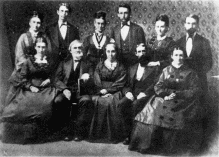 Standing: Matt (Mrs. W. B. Smith), R. A. Carr, Mrs. O. A. Carr, O. A. Carr, Mrs. H. P. Carr, Owen Carr. Sitting: Mary (Mrs. Goddard), Wm. Carr, Mrs. Wm. Carr, Capt. H. P. Carr, Minnie (Mrs. Jno. W. Fox, Sr.) HOME AGAIN—ALL HERE