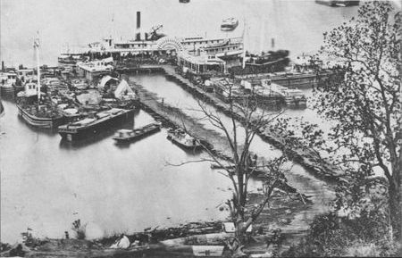 Federal ships crowd the magazine wharf at City Point with equipment and supplies for army wagons from Petersburg. Twenty per cent of the total supply tonnage was transported by water.