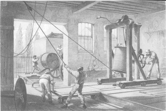 F. Jones, lith from a drawing by R. Dudley  London, Day & Sons, Limited, Lith.  THE REELS OF GUTTA PERCHA COVERED CONDUCTING WIRE CONVEYED INTO TANKS AT THE WORKS AT GREENWICH.