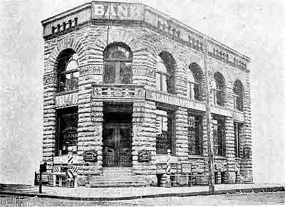 Corner entrance view of Second-Empire-Baroque-Style two story construction.