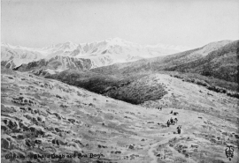 THE MOUNTAINS OF TKHUMA AND JILU.  From the top of the “Staircase” pass immediately above Amadia. The mountain in the centre is Ghara Dagh on the southern side of Tkhuma. To the left is Galiashin, the dominant peak of Jilu; and Sat Dagh further off upon the right. The crags in the middle distance rise up out of the Zab Gorge.  No. 8