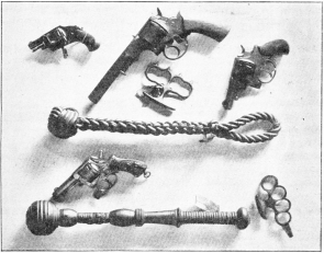 CRIMINALS’ WEAPONS: REVOLVERS, KNUCKLE DUSTERS, AND LIFE PRESERVERS IN THE BLACK MUSEUM.  Photo: Cassell & Company, Limited.