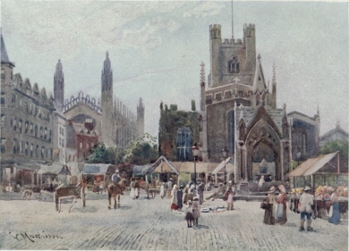 MARKET SQUARE  This picture represents what is called Half Market, which takes place on Wednesday. Market day, properly speaking, is on Saturday, when the square is filled with stalls. The church is Great St. Mary’s, and King’s College Chapel is seen in the distance on the left.