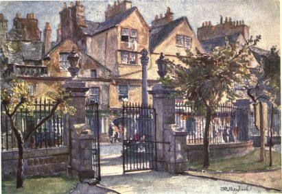 OLD HOUSES IN CANONGATE  In the foreground of the picture are the piers and entrance gates of the Canongate Parish Church. Past the shaft of the cross on the other side of the Canongate is the opening into Bakehouse Close. The timber-fronted houses with their gables present as picturesque an appearance as any in Edinburgh.