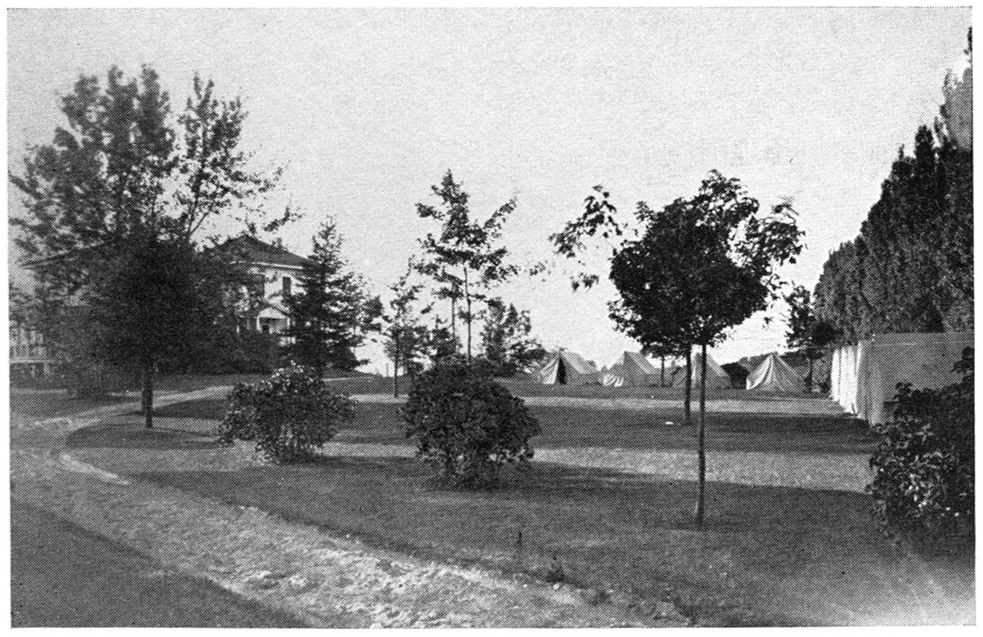 Hotel building at Orchard Beach State Park, Michigan. Note the tents provided for motor campers, rented at lower than room rates to those taking their meals at the hotel