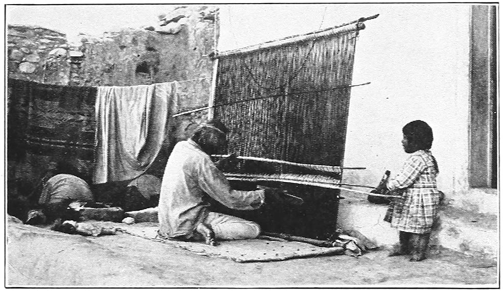 A HOPI WEAVER OF CEREMONIAL ROBES