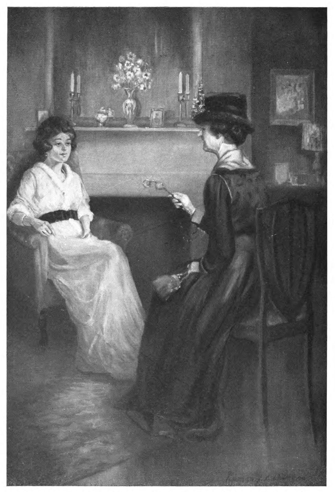 Two ladies chatting by a fireplace