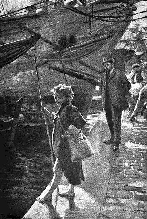 A young barefoot boy, dressed in tattered clothing and wrapped in a long, ragged coat, stands near the edge of a dock. Behind him, a well-dressed man wearing a hat and coat is walking along the dock, seemingly observing the boy.