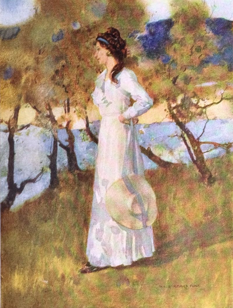 Lady in white standing on a hillside overlooking a river