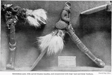 Tourist Dept. Photo.

Greenstone axes, with carved wooden handles, and ornamented with dogs'
hair and birds' feathers.