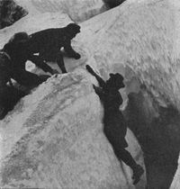 Miss Fay Fuller exploring a crevasse.