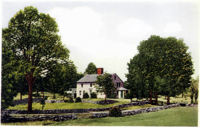 A farmhouse set between the trees