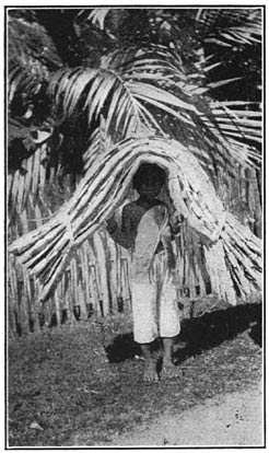 Plate I. Boy carrying a bastos mat, Argao, Cebu.