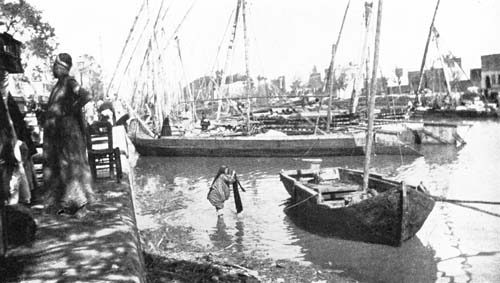 SHE WAS WASHING CLOTHES IN THE CANAL.