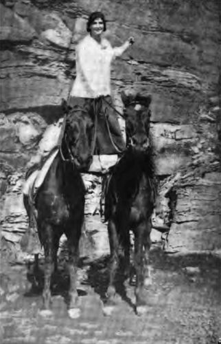 This photograph of a Camp Fire Girl shows the opportunity
country life affords for good sport.