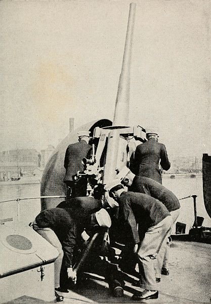 Marines loading a long deck gun