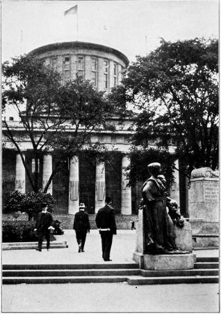 Looking into the State House grounds toward the broad
flight of steps before the west front of the building