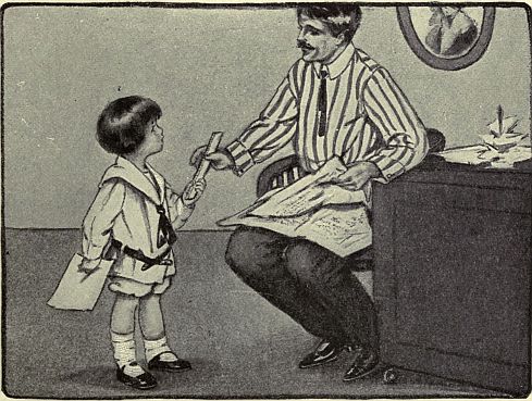 man handing ruler to son