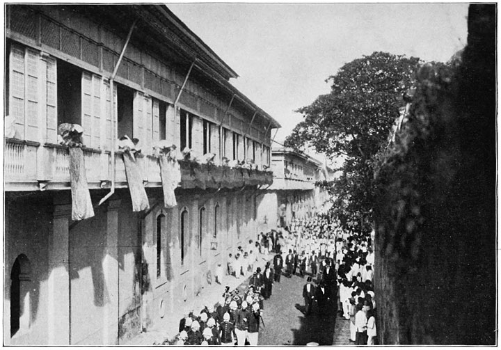 In the Narrow Streets of Old Manila. A Procession.